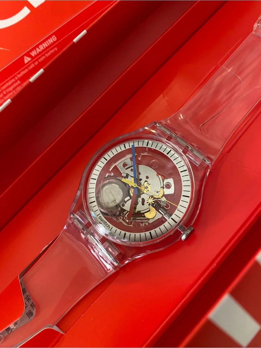 Swatch Transparent Strap Skeleton Watch with Blue Second Hand